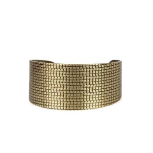 Gold braclet with gold and brown necklace with mat